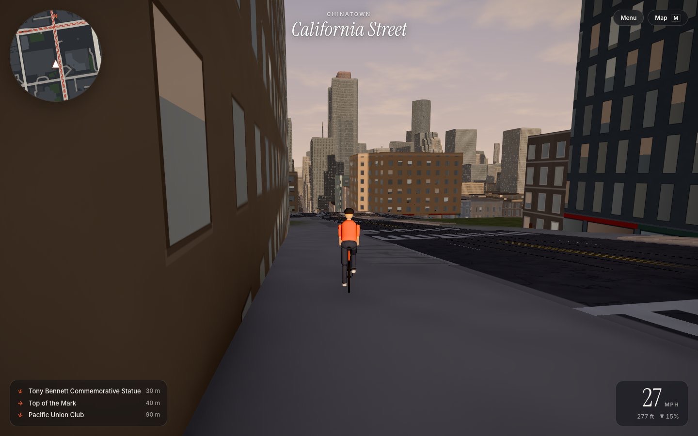 A cyclist riding down California Street towards the downtown towers